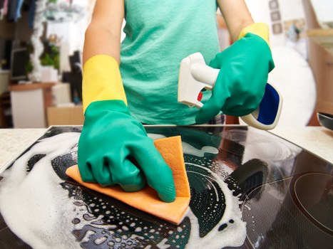 Technician preparing to clean a carpet in a home interior